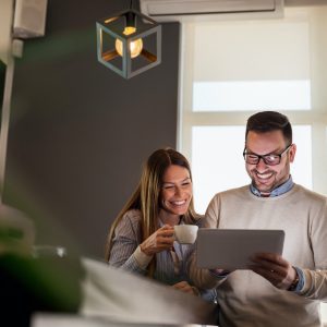 Couple using tablet computer